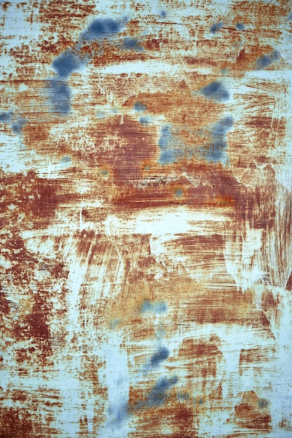 Rust metal texture with peeling paint, blue color. Textural background, copy space, shot from above. text underlay.