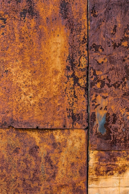 Rusted flat composite nailed metal sheets surface background and texture