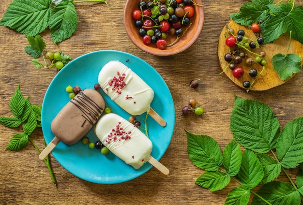 rustic concept breakfast on a wooden table white and chocolate ice cream on a blue plate