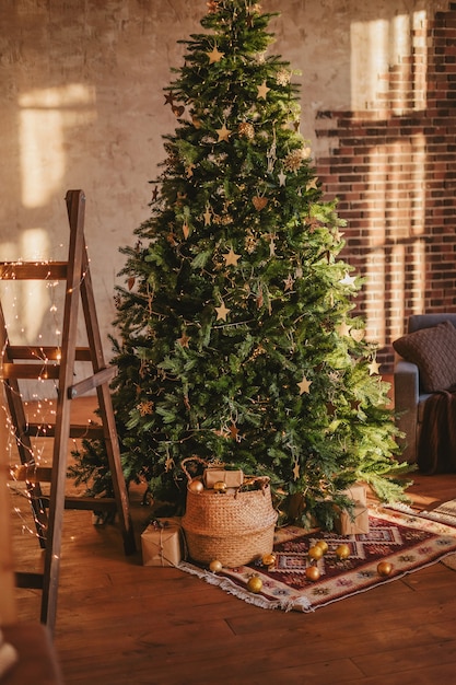 Rustic interior decorated for the new year. Christmas tree in a cozy living room.