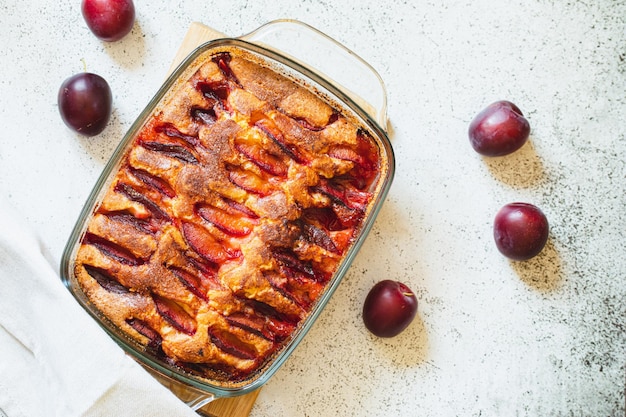 Rustic plum cake Copy space Top view flat lay Simple baking concept