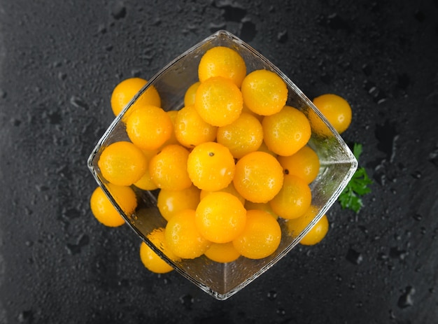 Rustic slate slab with Yellow Tomatoes selective focus