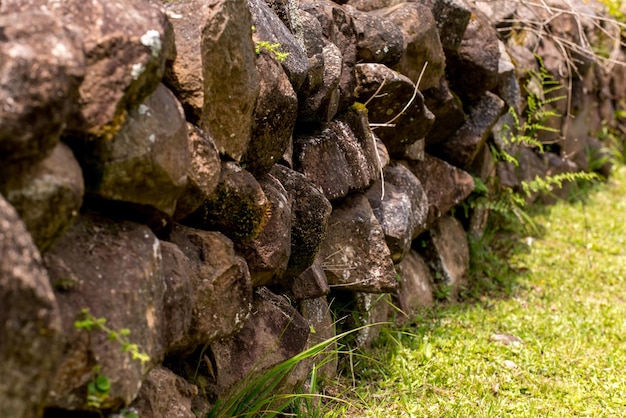 Rustic stone wall in the garden