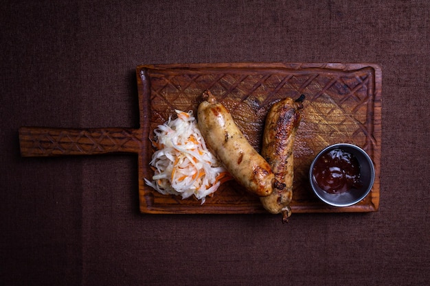 Rustic Table with Grilled Sausages Sauerkraut BBQ Sauce