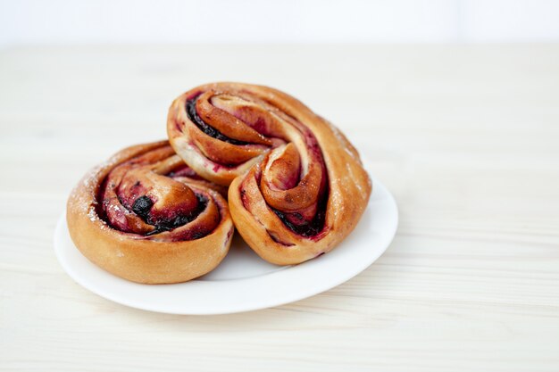 Rustic with black current berry pie on white background.