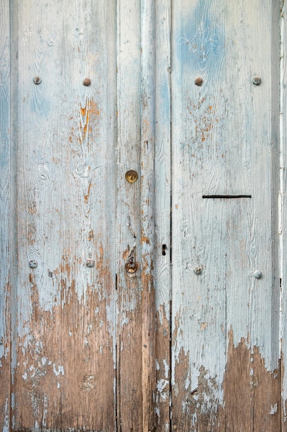 Rustic wood texture with natural pattern as background, Weathered wooden door with keyhole