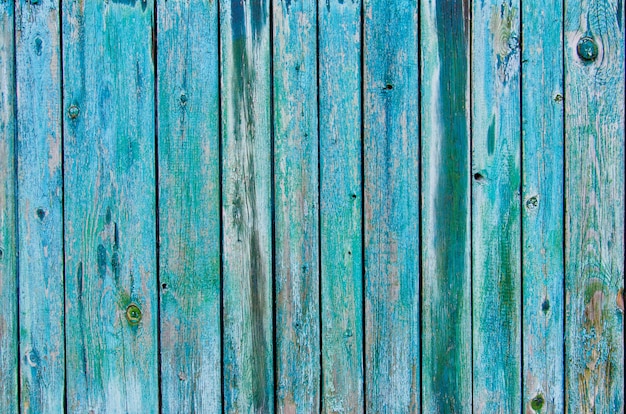 Rustic wooden fence texture background of green and blue colors