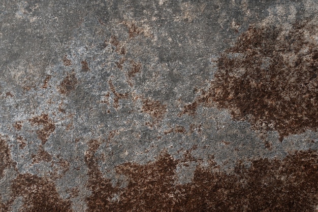 Rusty and damaged metal background. Elegant background or old chalkboard with vintage distressed grunge texture and dark gray charcoal color paint