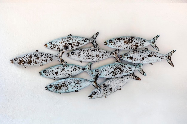 Rusty decorative fish on a wall