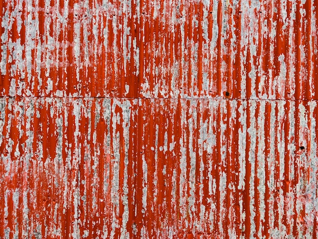 Rusty old red metallic wall texture background.