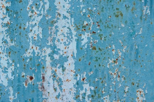 rusty surface with old blue paint as a background