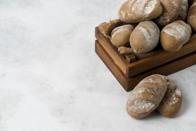 Rye Black bread composition on white background in wooden box collection