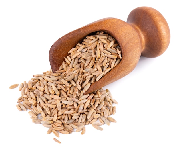 Rye grains isolated on white background Pile of rye malt seeds in wooden scoop Dry grains of winter rye