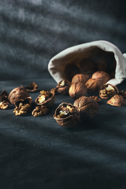 Sack of walnuts with copy space in dark mood shot