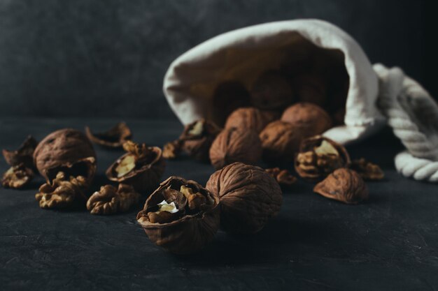 Sack of walnuts with copy space in dark mood shot