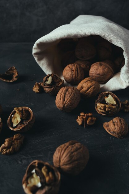 Sack of walnuts with copy space in dark mood shot