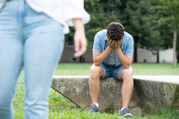 Sad boy crying after breakup with girlfriend