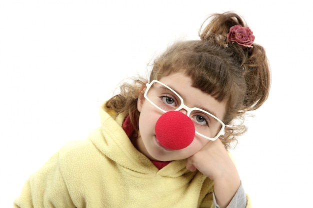 Sad clown nose little girl with big glasses