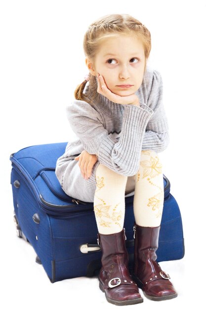 Sad girl with suitcase