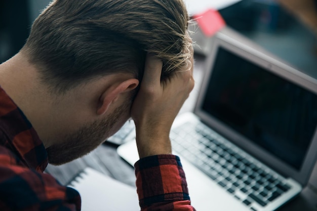 Sad man in desk