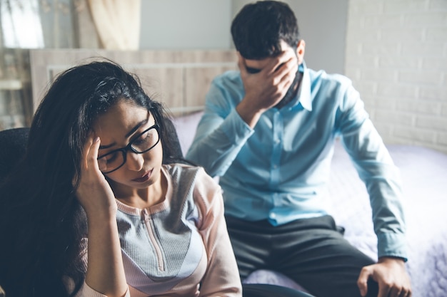 Sad man and woman  in home