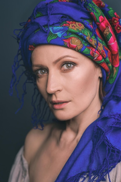 Sad mature woman in ukrainian national headdress