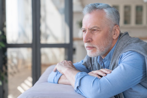 Sad pensive lonely caucasian old elderly senior man grandfather having problem