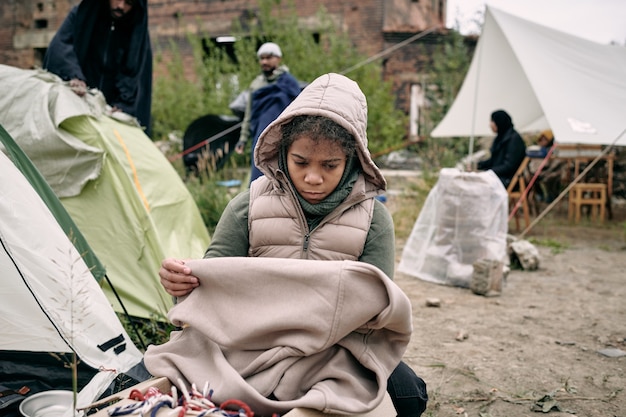 Sad Refugee Girl With Plaid