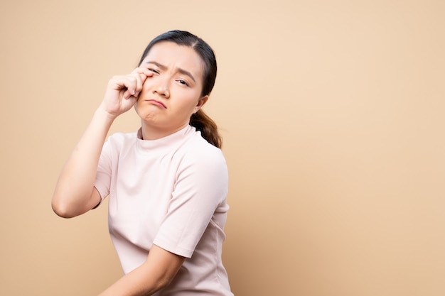 Sad woman crying and standing isolated