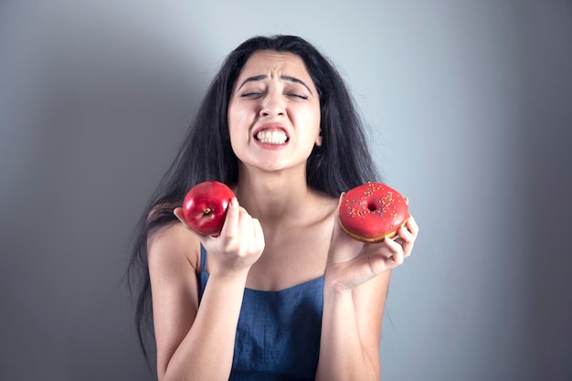 Sad woman hand donut