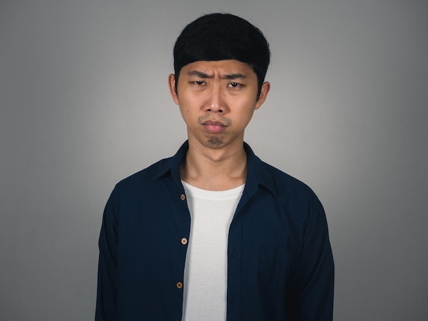 Sadness asian man feels depressed about bad life isolated