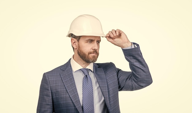 Photo safety business successful man with greeting gesture entrepreneur in protective helmet chief architect engineer professional engineer in hardhat confident businessman in suit isolated on white