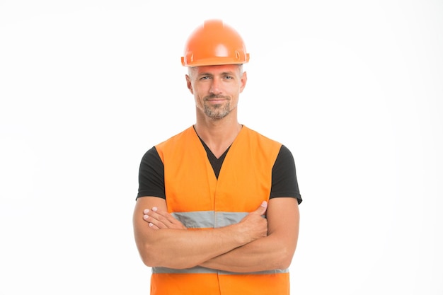 Safety is main point. Man protective hard hat and uniform white background. Worker builder confident looking camera. Protective equipment concept. Builder crossed hands chest. Strong handsome builder.