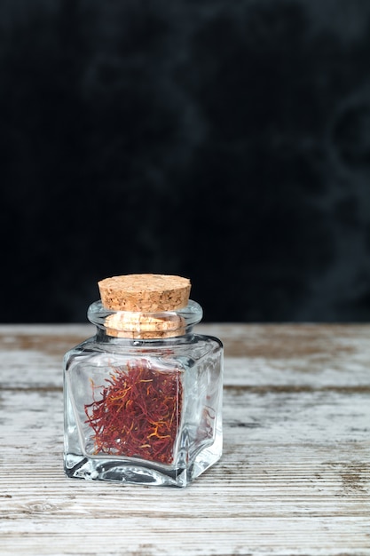 Saffron threads in a glass jar