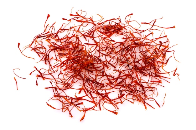 Saffron threads isolated on white surface