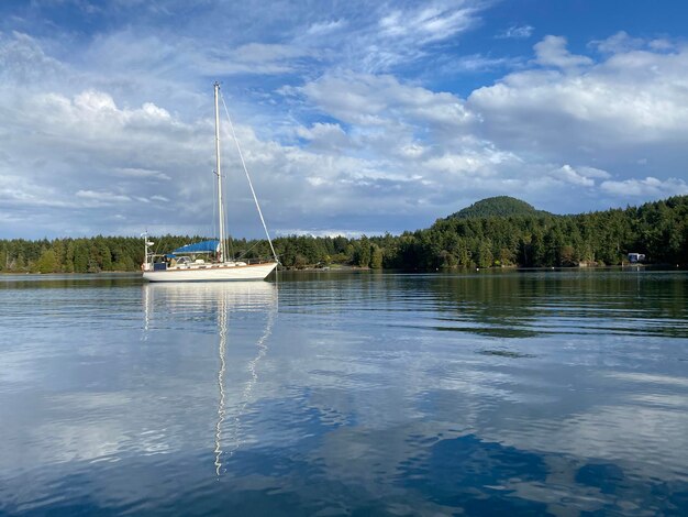 Sailboat in a beautiful and peaceful cove with blue skies