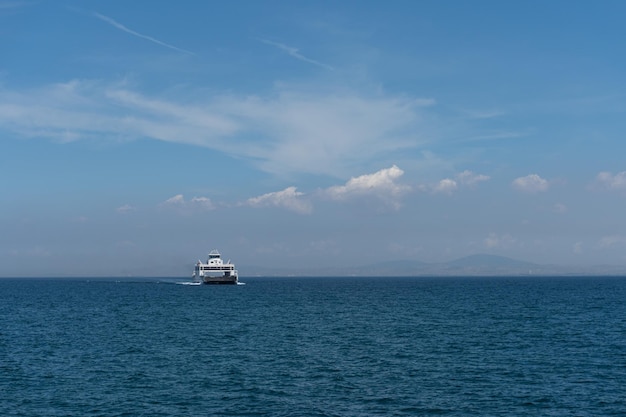 Sailboat sailing on sea against sky