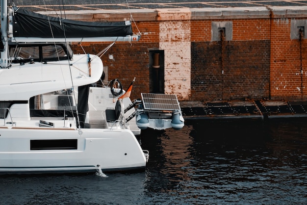 Sailing yacht with solar panels on the roof Natureproduced energy Sunproduced energy Photovolta