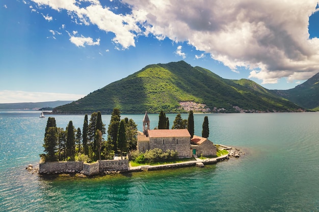 Saint George Island and cloudy blue sky in Perast, Montenegro