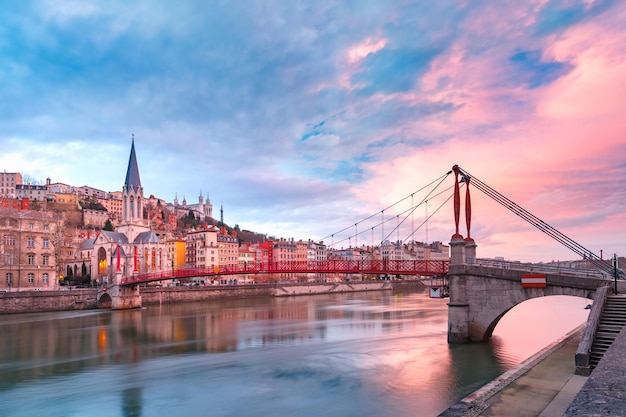 Saint georges church and footbridge across saone river old town with fourviere cathedral at gorgeous