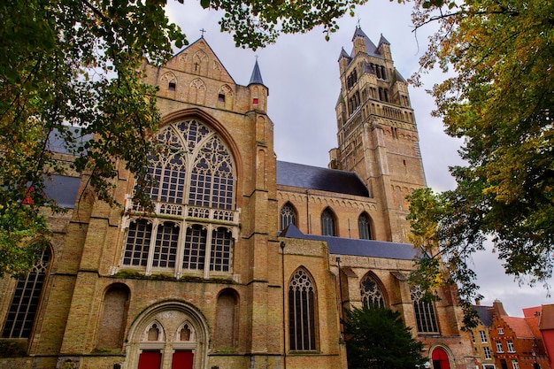 Saint Salvator Cathedral made of old bricks on ancient medieval street in Bruges Brugge