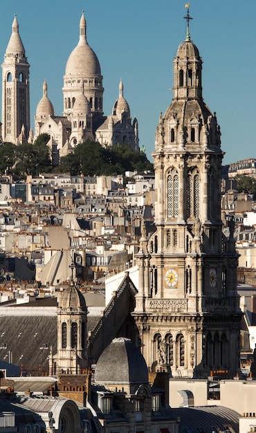 The Saint Trinity church and Sacre Coeur basilica Paris France