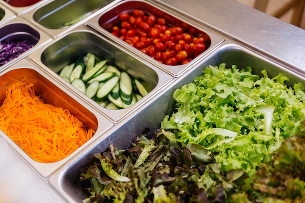 Salad bar with assortment of ingredients for healthy and diet meal