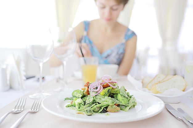 Salad in a cafe diet girl