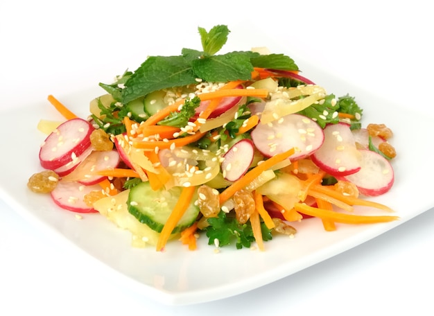 Salad of carrot, radish, cucumber, raisins, sesame and herbs