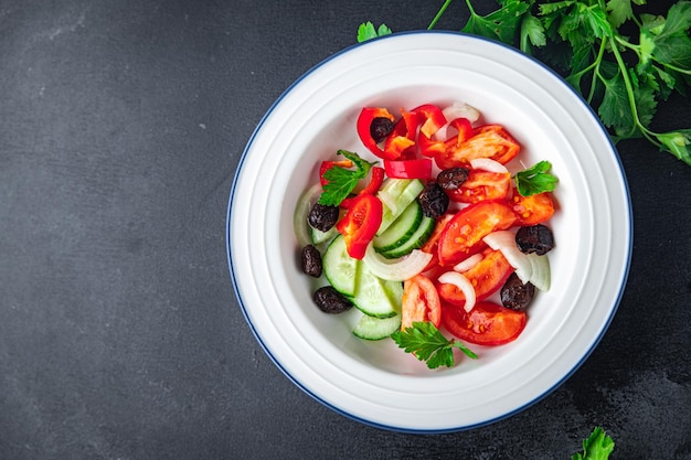 Salad dried olives and vegetables a la Greek salad healthy meal food snack on the table