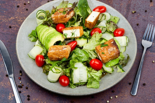 Salad of fried tofu and fresh vegetables