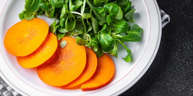 salad persimmon green lettuce fresh meal food snack on the table copy space food background rustic