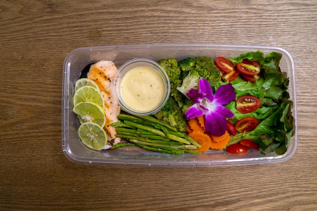 Salad in plastic box package delivery ready to eat