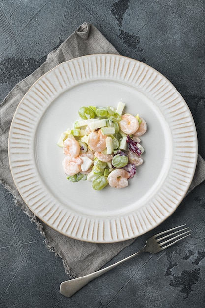 Salad of shrimp avocado, Prawn Waldorf  set , with sauce apple and grape, on gray background, top view flat lay